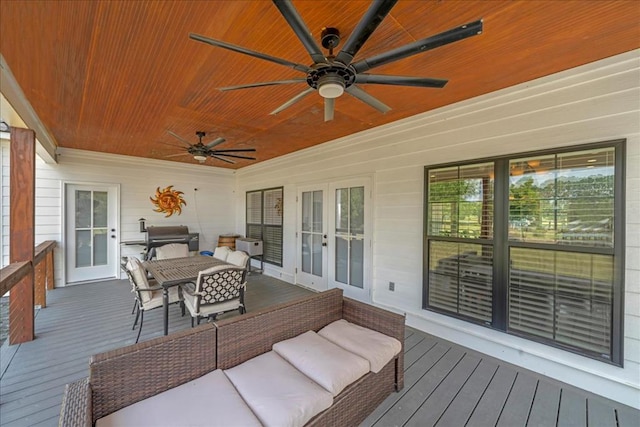 wooden terrace featuring an outdoor living space, a grill, and ceiling fan