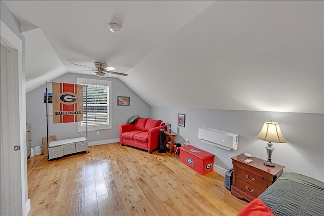 interior space with lofted ceiling, ceiling fan, and light wood-type flooring