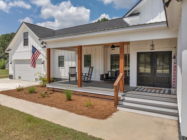 view of front facade featuring a garage, french doors, ceiling fan, and a porch