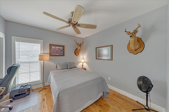 bedroom featuring wood-type flooring and ceiling fan