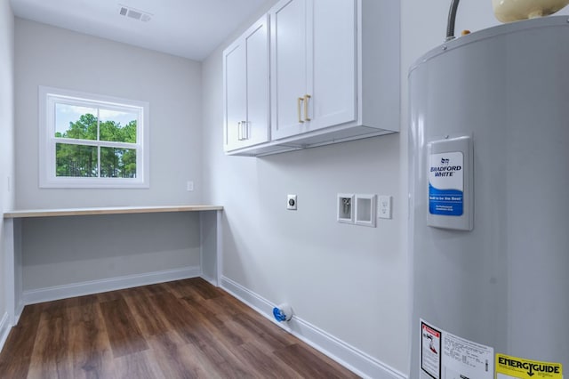 laundry room with water heater, cabinets, washer hookup, dark wood-type flooring, and hookup for an electric dryer