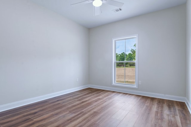 spare room with wood-type flooring and ceiling fan