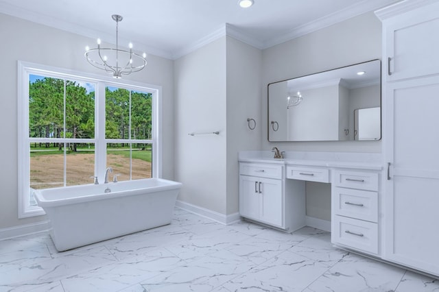 bathroom featuring an inviting chandelier, a tub to relax in, ornamental molding, and vanity