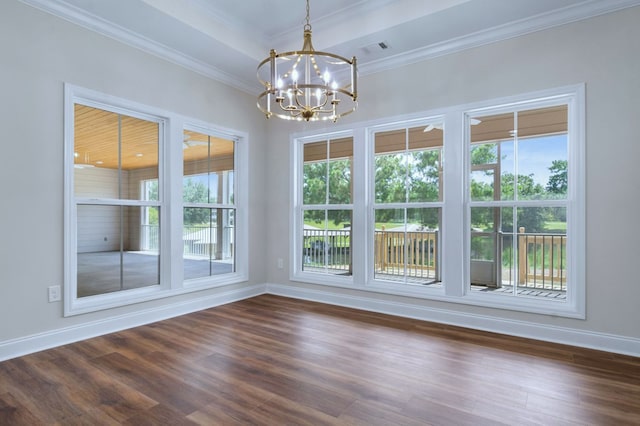 unfurnished dining area featuring ornamental molding, dark hardwood / wood-style flooring, a chandelier, and a raised ceiling