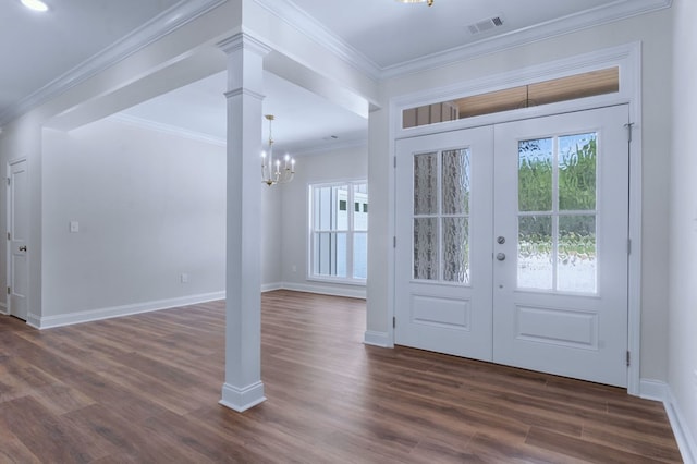 foyer entrance with ornate columns, crown molding, dark hardwood / wood-style flooring, and french doors