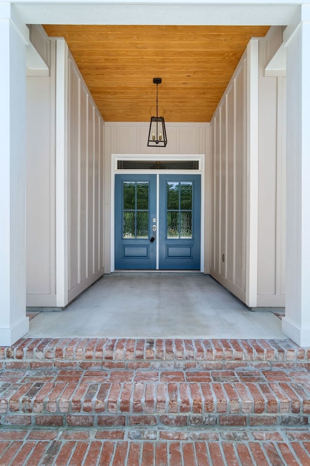 view of exterior entry featuring french doors