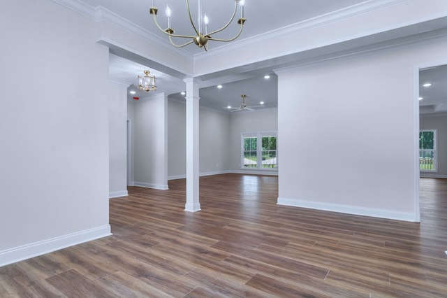 spare room with ornamental molding, dark hardwood / wood-style flooring, and decorative columns