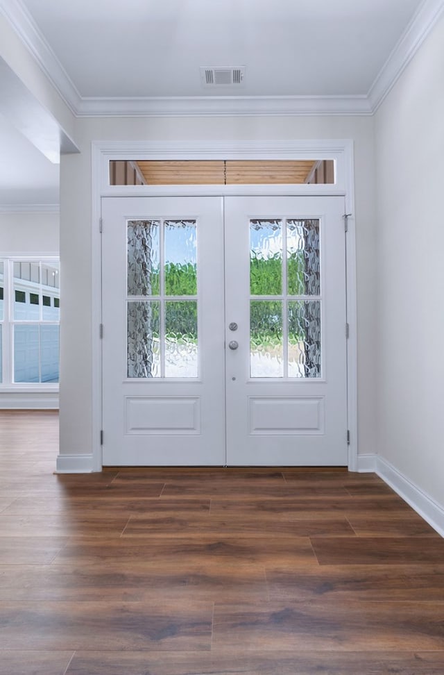 entryway with crown molding, dark wood-type flooring, and french doors