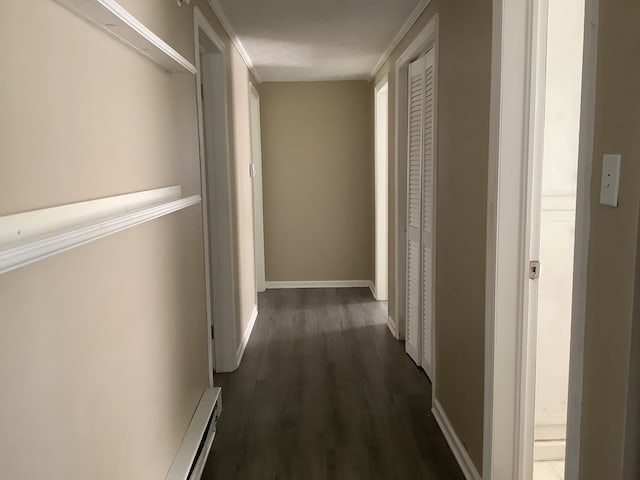 hall featuring dark wood-style floors and baseboards