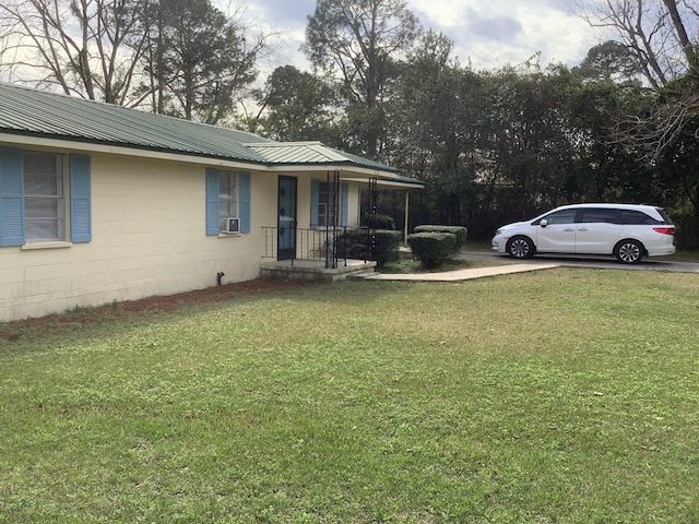 view of yard with a porch and cooling unit