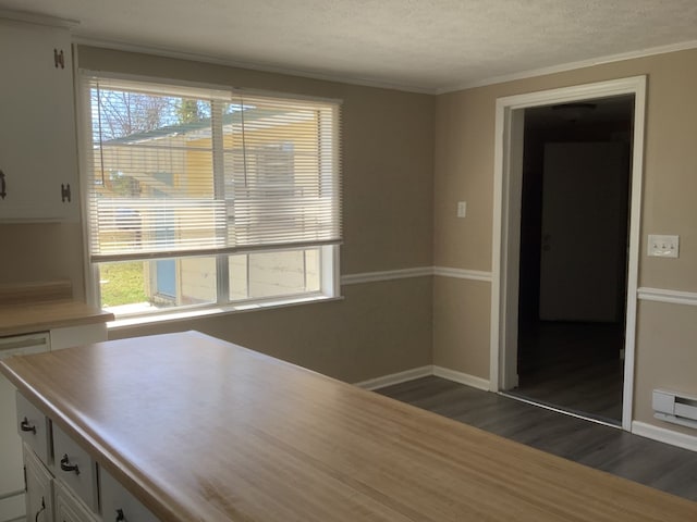 interior space with dishwashing machine, dark wood-type flooring, white cabinetry, baseboards, and light countertops