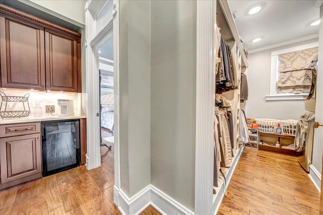 interior space featuring light wood-type flooring and wine cooler