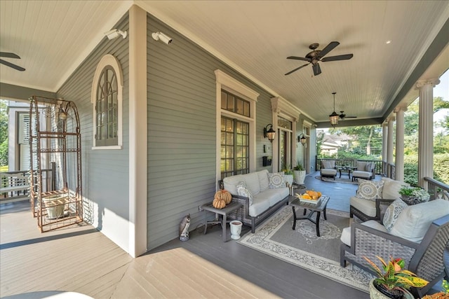 deck featuring an outdoor living space, ceiling fan, and covered porch