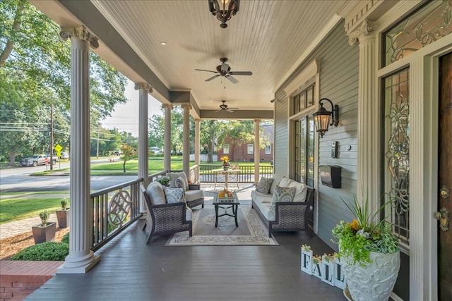 wooden terrace with ceiling fan and a porch