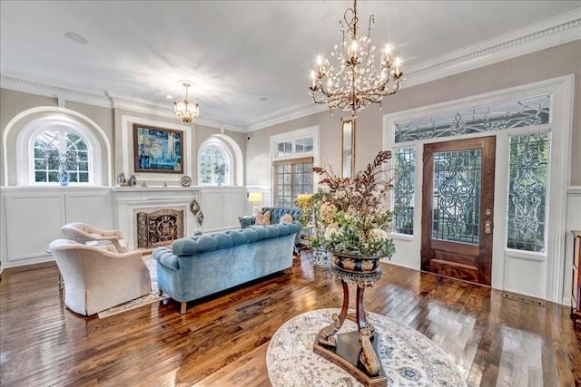 interior space featuring hardwood / wood-style flooring, ornamental molding, and a premium fireplace