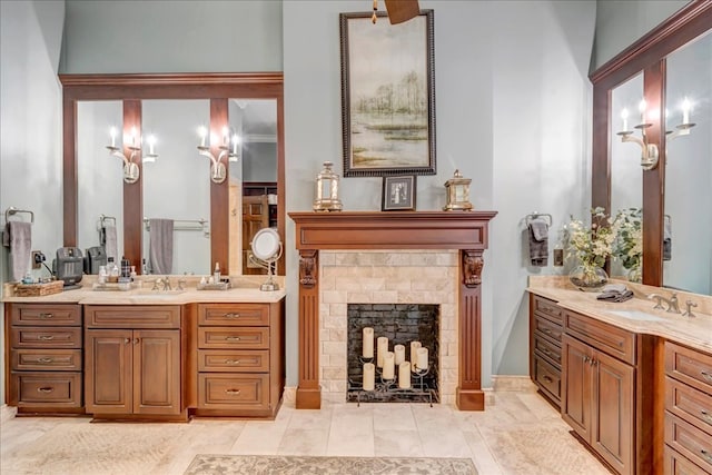 bathroom with a tile fireplace and vanity