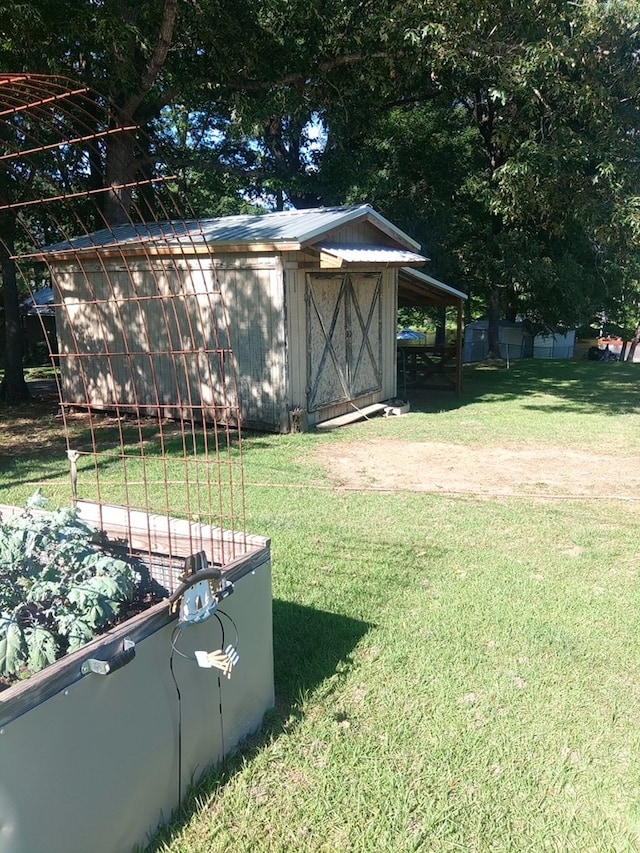 480 Spring Creek Rd, Warwick, GA 31796 - view of grassy yard with a storage shed and an outdoor structure