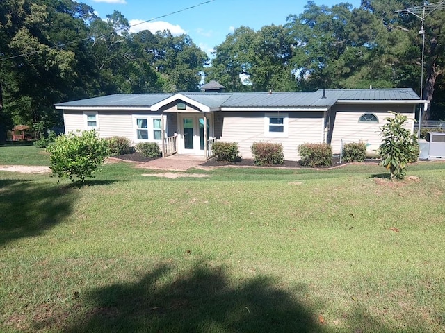 480 Spring Creek Rd, Warwick, GA 31796 - ranch-style home featuring a front lawn, french doors, and metal roof