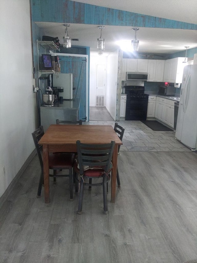 480 Spring Creek Rd, Warwick, GA 31796 - dining space featuring wood finished floors and baseboards