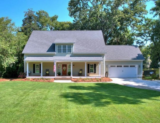 view of front facade featuring a porch, a garage, and a front lawn