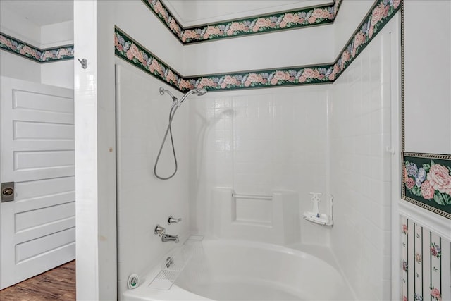 bathroom featuring bathtub / shower combination and hardwood / wood-style floors