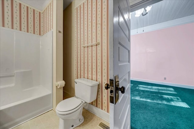 bathroom featuring shower / bathtub combination and toilet