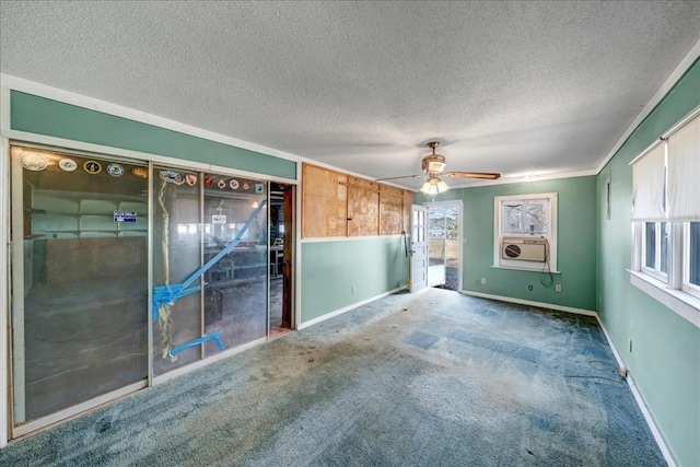 unfurnished room featuring carpet flooring, cooling unit, ceiling fan, and ornamental molding