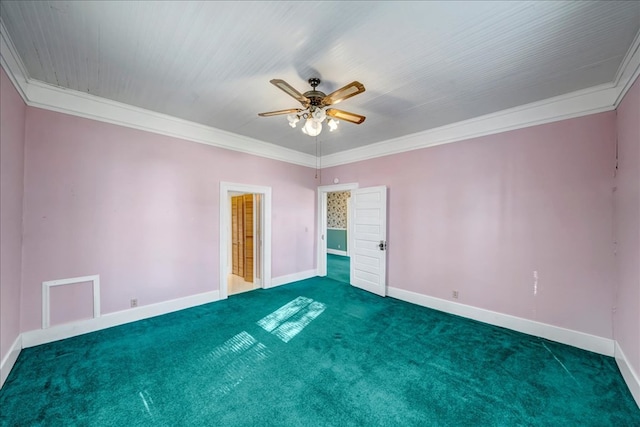 carpeted empty room with ceiling fan and crown molding