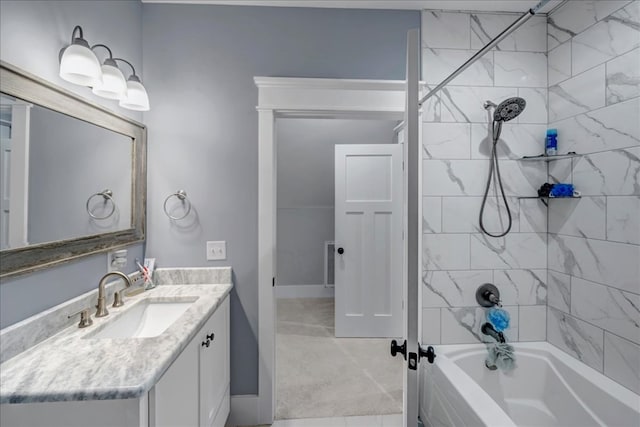 bathroom with tiled shower / bath and vanity