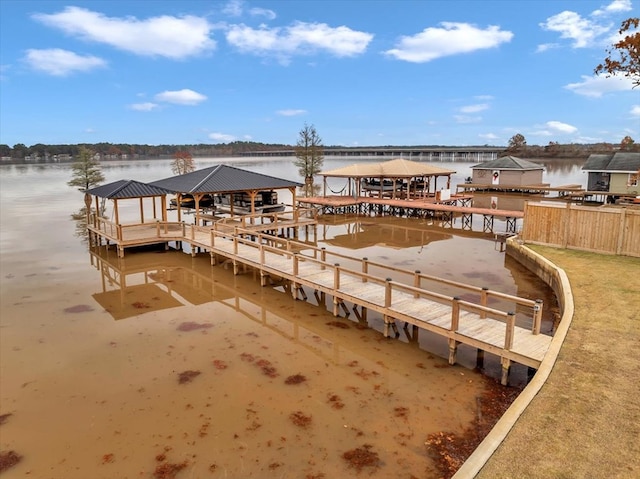 dock area with a gazebo and a water view