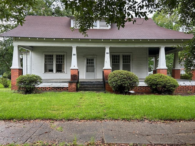 view of front of house featuring a front yard and a porch