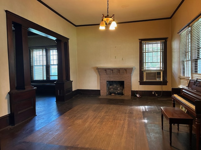 living room with cooling unit, dark hardwood / wood-style flooring, ornate columns, a fireplace, and crown molding