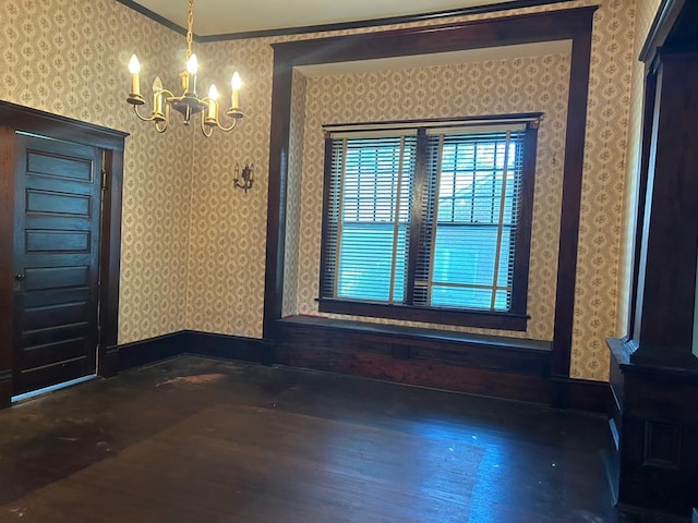 unfurnished dining area featuring crown molding, dark wood-type flooring, and an inviting chandelier