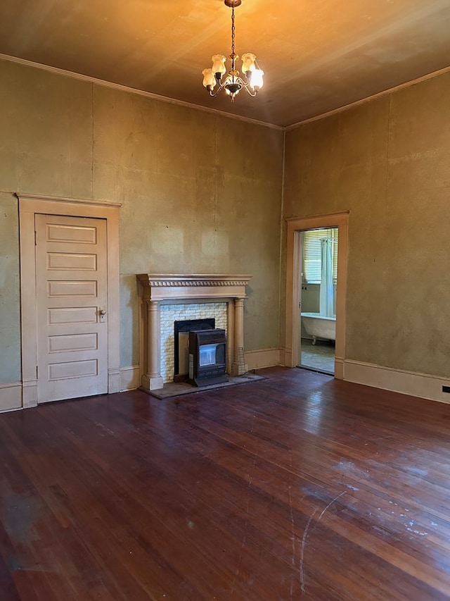 unfurnished living room with dark wood-type flooring and a notable chandelier