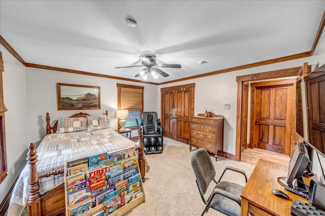 carpeted bedroom with ceiling fan, ornamental molding, and a textured ceiling