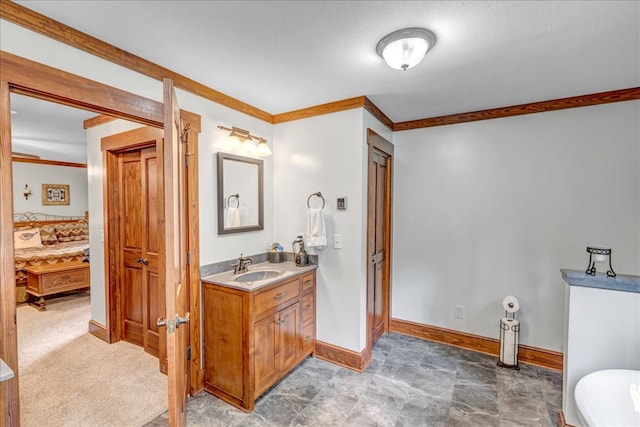 bathroom with vanity and crown molding