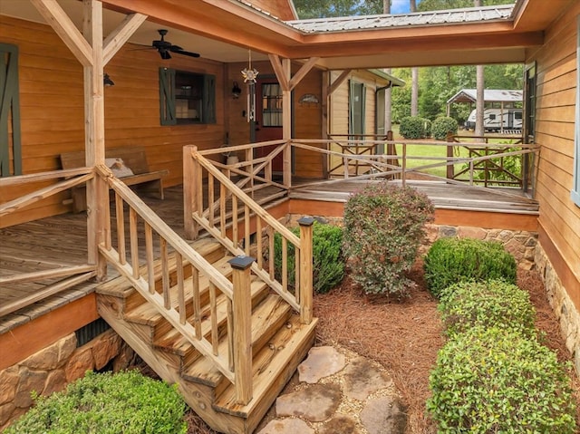 wooden terrace featuring ceiling fan and a porch