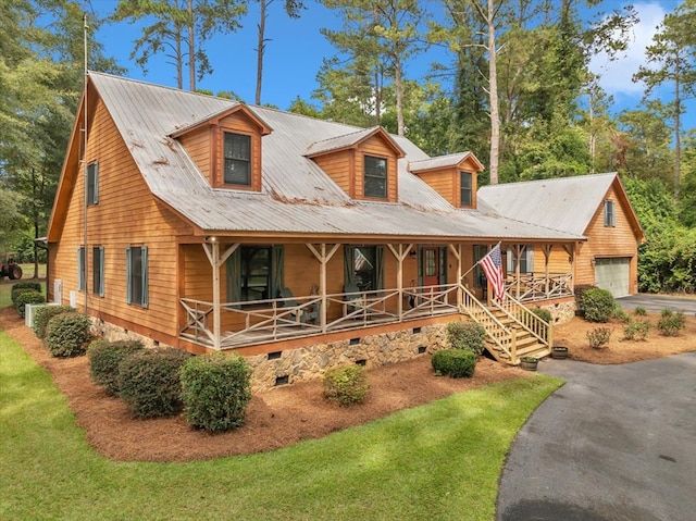 view of front facade featuring a garage and covered porch