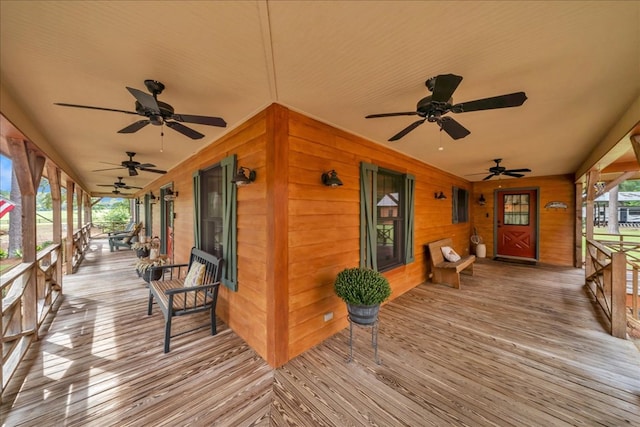 deck with a porch and ceiling fan