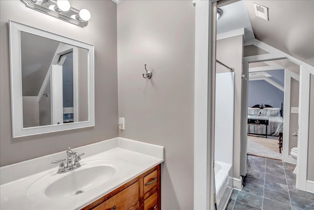 full bathroom featuring vanity, toilet, lofted ceiling, and plus walk in shower