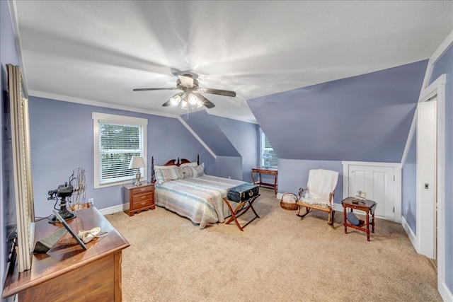 carpeted bedroom with vaulted ceiling and ceiling fan