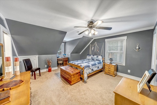 carpeted bedroom featuring lofted ceiling, a textured ceiling, and ceiling fan