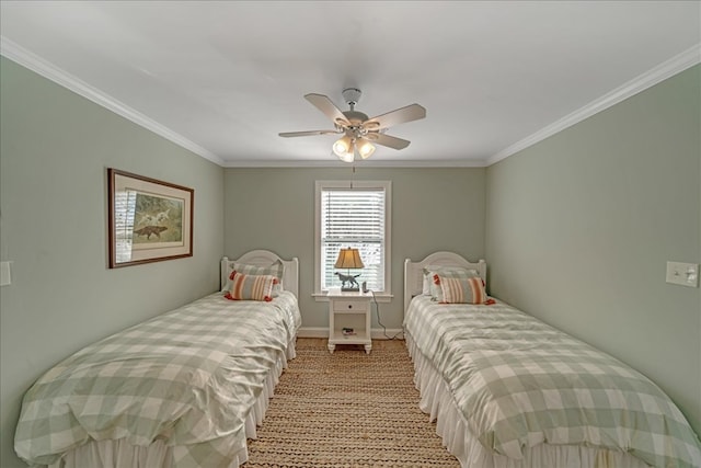 bedroom with a ceiling fan, light colored carpet, crown molding, and baseboards