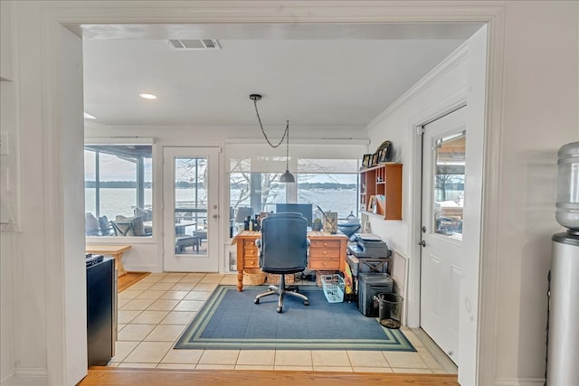 office area featuring ornamental molding, a healthy amount of sunlight, visible vents, and light tile patterned floors