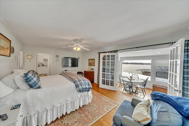 bedroom with ceiling fan, access to outside, light wood finished floors, and crown molding