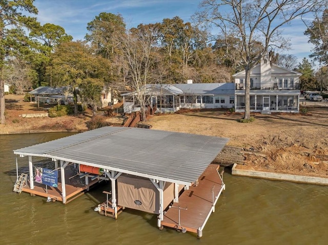 view of dock featuring a water view and boat lift