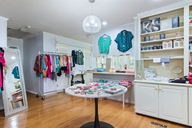 spacious closet featuring light hardwood / wood-style flooring