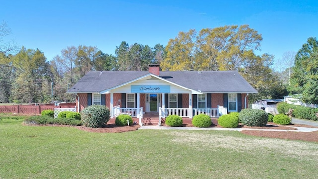 view of front of home with a front yard and a porch