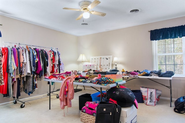 bedroom with crown molding, multiple windows, carpet flooring, and ceiling fan