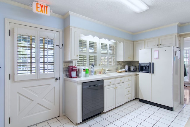 kitchen featuring plenty of natural light, a textured ceiling, white refrigerator with ice dispenser, and dishwasher